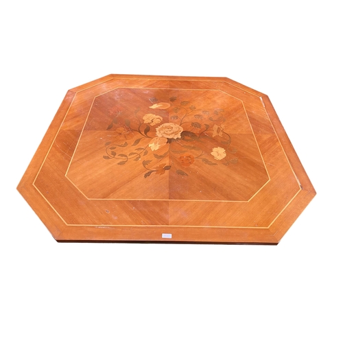 472 - A hexagonal Coffee table on single turned support with Sorento style inlaid top, 130 x 44cm