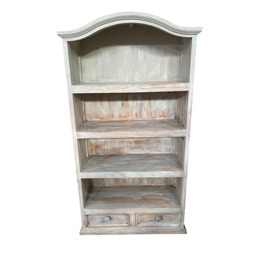 476 - A pair of vintage chalk painted and distressed arch topped open bookcases, four fitted shelves with ... 