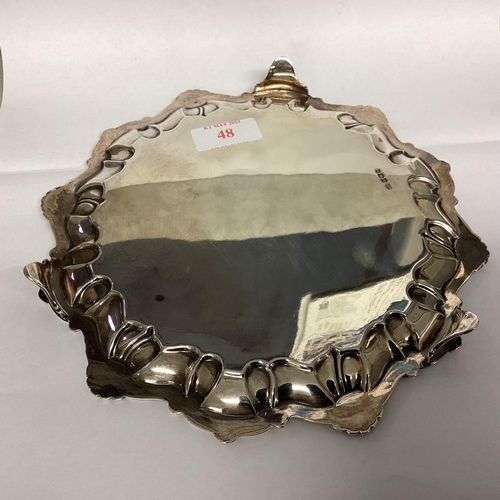 48 - A Sterling silver circular card tray with scalloped edge on three feet, 324g, 22cm diam, by Lee & Wi... 