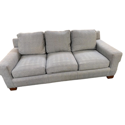 495 - A large three seater sofa, retailed by Ralph Lauren. Upholstered in a black and white Prince of Wale... 