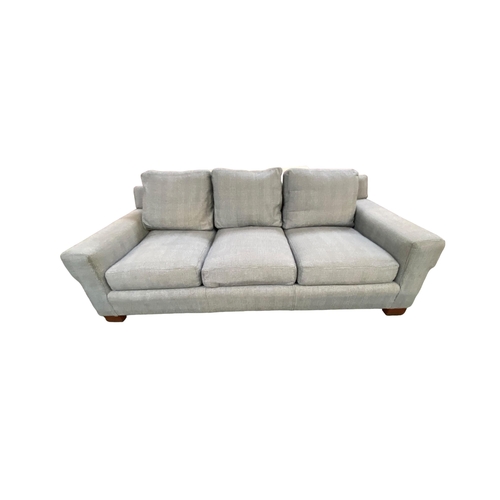 495 - A large three seater sofa, retailed by Ralph Lauren. Upholstered in a black and white Prince of Wale... 