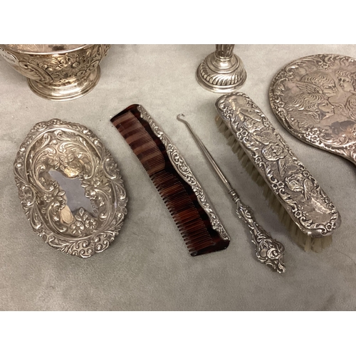 50 - A collection of Sterling silver items to include a silver dressing set, bowl, dish, comb, etc variou... 