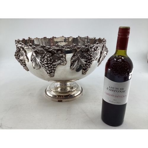 58 - Large silver plated punch bowl with cast grape and vine decoration on circular reeded foot by Walker... 