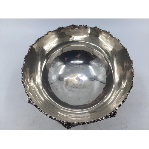 58 - Large silver plated punch bowl with cast grape and vine decoration on circular reeded foot by Walker... 