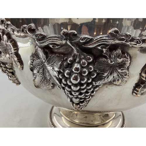 58 - Large silver plated punch bowl with cast grape and vine decoration on circular reeded foot by Walker... 