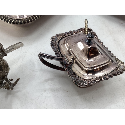 60 - Collection of silver plated wares to include two lidded dishes, salt cellars and white metal rooster... 