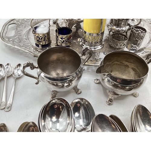 61 - Collection of silver plated items to include oval tray with pierced border, coffee pot, sugar shaker... 