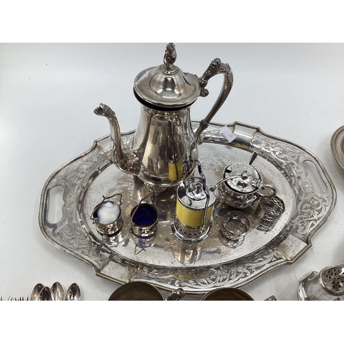 61 - Collection of silver plated items to include oval tray with pierced border, coffee pot, sugar shaker... 