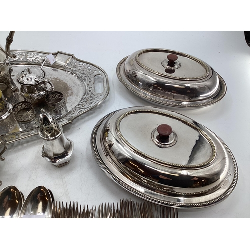 61 - Collection of silver plated items to include oval tray with pierced border, coffee pot, sugar shaker... 