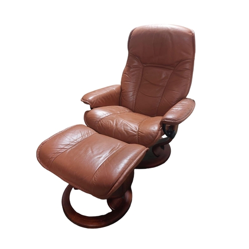 610 - A brown leather chair and footstool