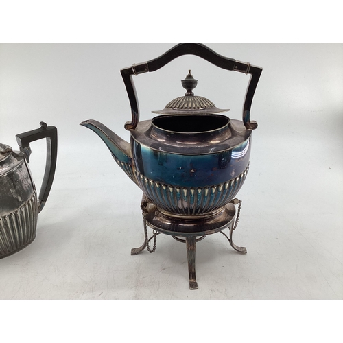 63 - Collection of silver plated wares to include kettle on burner, ornately decorated teapot and small g... 