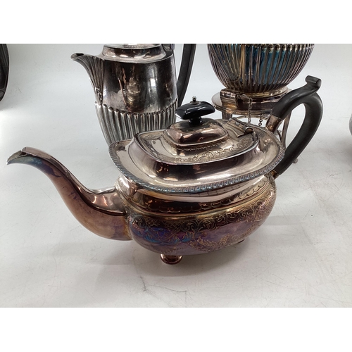 63 - Collection of silver plated wares to include kettle on burner, ornately decorated teapot and small g... 