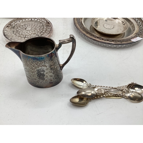 66 - Large collection of silver plated ware to include flatware candlesticks, sauceboats, white metal mou... 