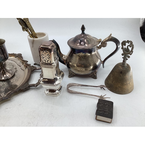 66 - Large collection of silver plated ware to include flatware candlesticks, sauceboats, white metal mou... 