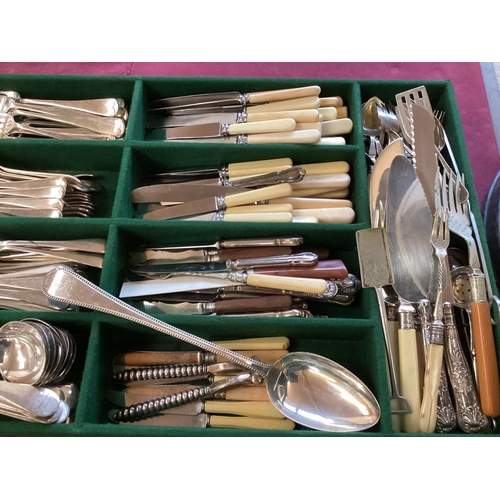 66 - Large collection of silver plated ware to include flatware candlesticks, sauceboats, white metal mou... 