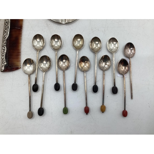 67 - Collection of Stirling silver items to include a dressing set, collection of coffee spoons with bean... 