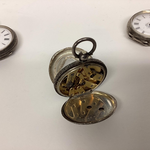 69 - A collection of four sterling silver ladies pocket watches, together with a pair of yellow metal lun... 