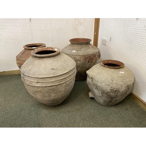 74 - Four similar terracotta bulbous pots, tallest approx. 55cm H, all with some wear and rustic, see ima... 