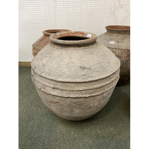 74 - Four similar terracotta bulbous pots, tallest approx. 55cm H, all with some wear and rustic, see ima... 