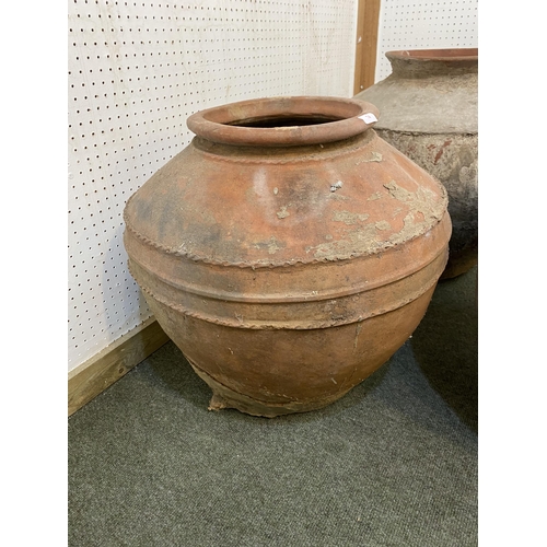 74 - Four similar terracotta bulbous pots, tallest approx. 55cm H, all with some wear and rustic, see ima... 