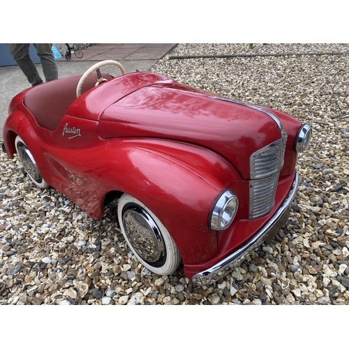 89 - An original Austin J40 Pedal Car, finished in red with chrome fixtures and fittings, complete with h... 