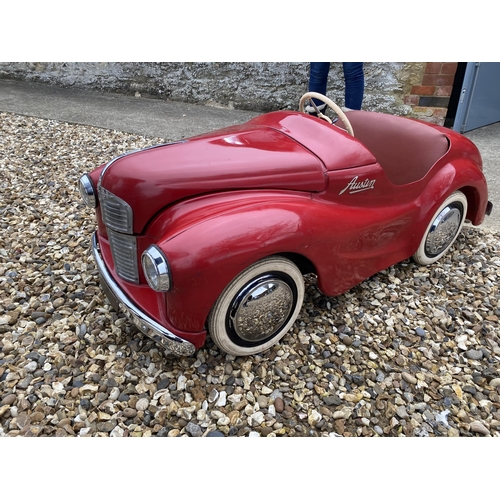 89 - An original Austin J40 Pedal Car, finished in red with chrome fixtures and fittings, complete with h... 