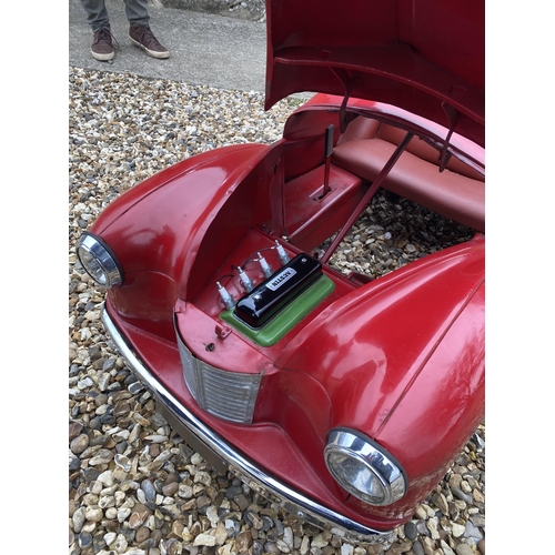 89 - An original Austin J40 Pedal Car, finished in red with chrome fixtures and fittings, complete with h... 