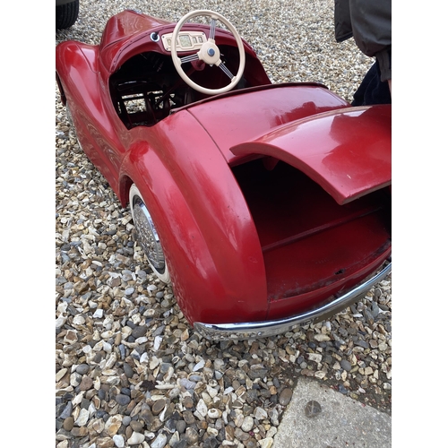 89 - An original Austin J40 Pedal Car, finished in red with chrome fixtures and fittings, complete with h... 