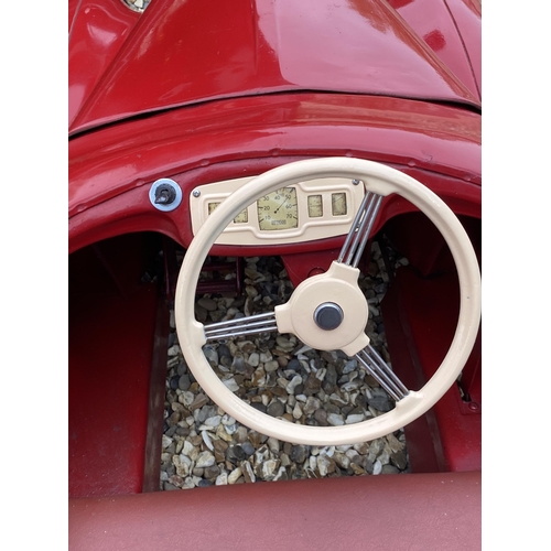 89 - An original Austin J40 Pedal Car, finished in red with chrome fixtures and fittings, complete with h... 