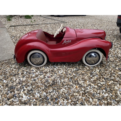 89 - An original Austin J40 Pedal Car, finished in red with chrome fixtures and fittings, complete with h... 