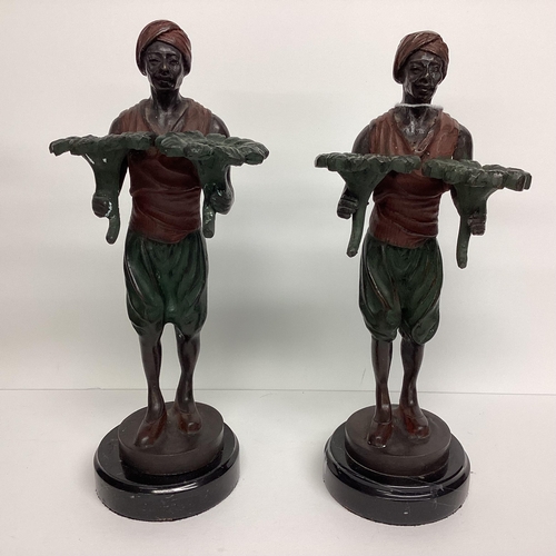 92 - Pair of Bergman style north African bronze figures, engraved to base Bergman, on circular hardstone ... 