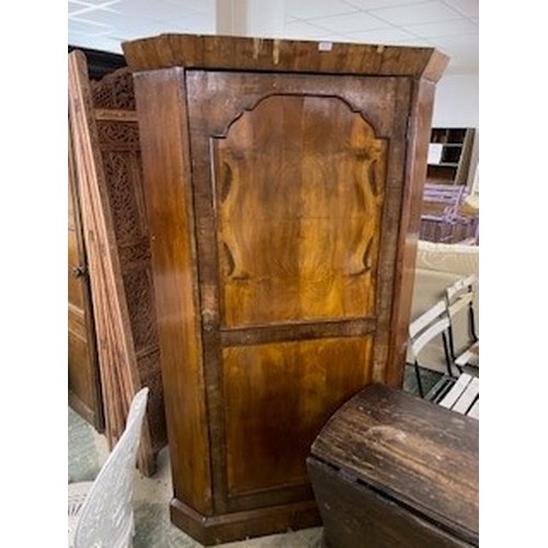 603 - Mahogany veneered corner wardrobe, with single brass rail, 180cm H x 105cm   some losses to veneer