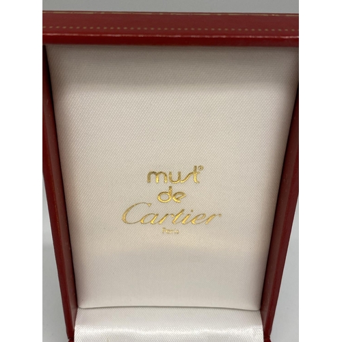 106 - A Cartier Gold plated lighter in red tooled Cartier Box