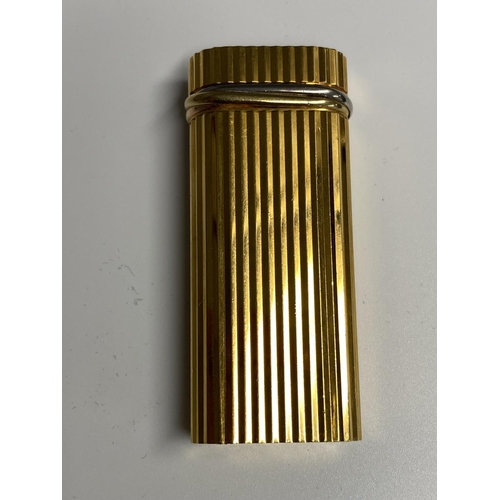 106 - A Cartier Gold plated lighter in red tooled Cartier Box