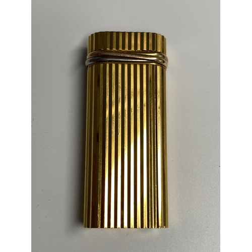 106 - A Cartier Gold plated lighter in red tooled Cartier Box