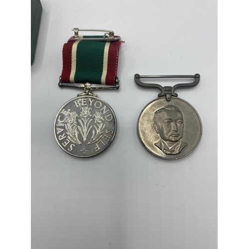 115 - A woman's voluntary service medal, together with Rhodesian district service medal to PR23206 RFN TW ... 