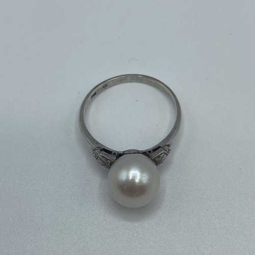 21 - A strand of graduated pearls on a white metal clasp 52cm, together with a matching pearl set ring si... 