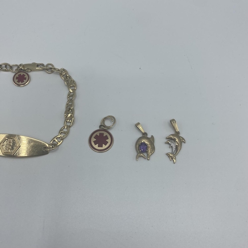 35 - A 10ct gold marked ID bracelet with 9ct and 10ct charms  12.5g