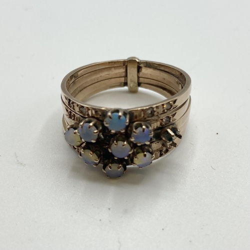 39 - A 10k marked five band moonstone and diamond chip set ring, some vacant settings, 5.8g size P