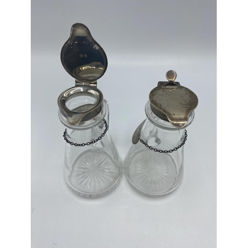 61 - A pair of silver topped whisky noggins with silver labels and a collection of sterling silver flatwa... 