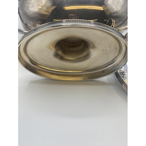 69 - A pair of sterling silver Adams style lidded sauce tureens by CJ Vander London 1962. 32ozt. Approx