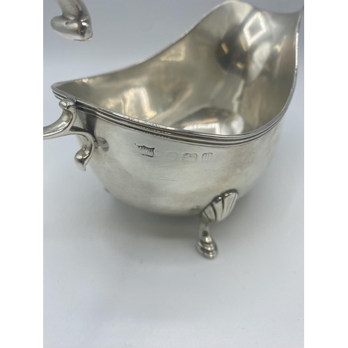 72 - A sterling silver sauce boat. Mappin and Webb. Birmingham. 1911. 176g.