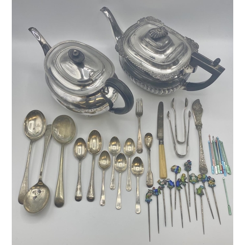 85 - Quantity of silver teaspoons, and two silver plate teapots, and cocktail sticks