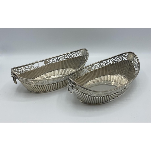 9 - Pair of Sterling Silver pierced oval baskets with lion and ring handles, Sheffield, 1885, 516g, some... 