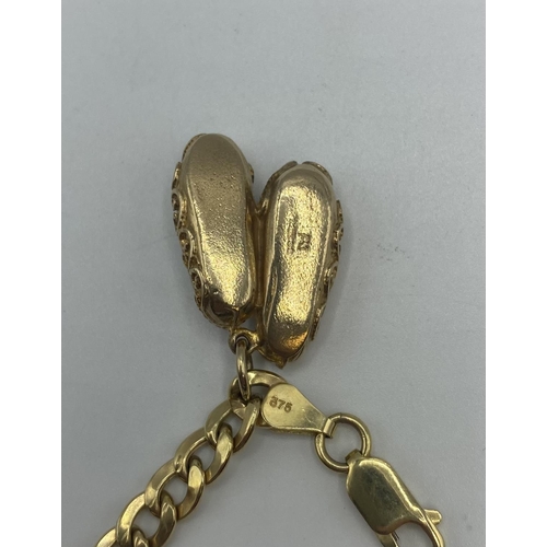 92 - A 9ct gold bracelet and slipper charm 9.5g