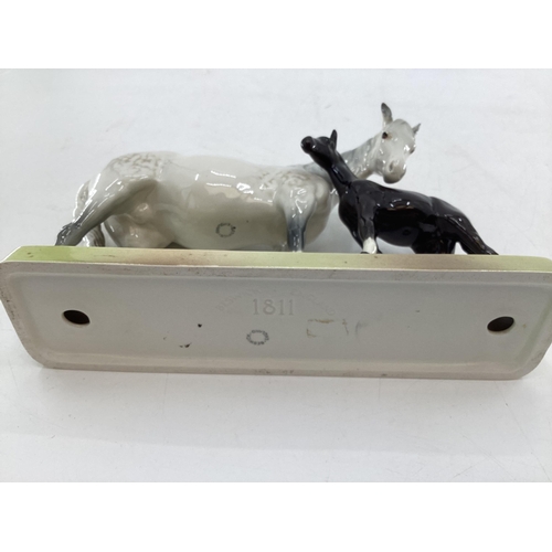 222 - A Beswick model of a dapple grey mare and bay foal on an oblong base ; together with a Beswick grey ... 