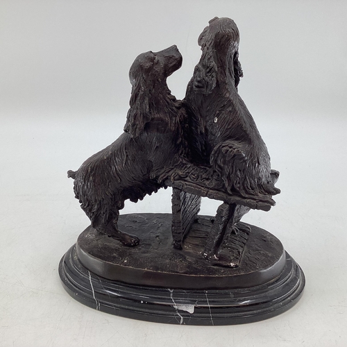 260 - A bronze model of a pair of spaniels, indistinct etched signature, possibly Aaure, on an oval marble... 