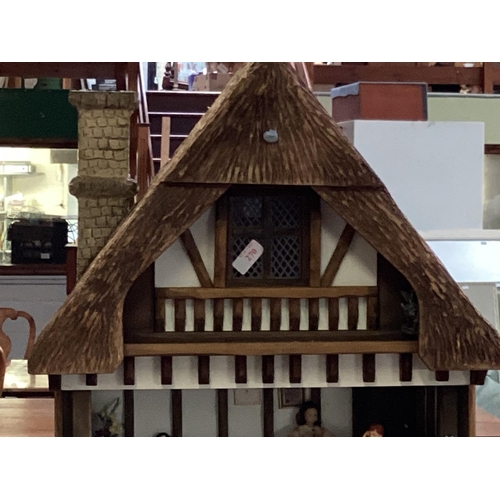 270 - A vintage dolls house, fitted interior some furniture 90cm x 48cm