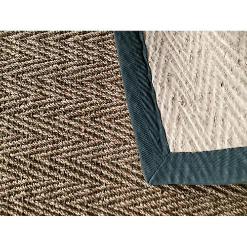 676 - A sisal runner rug, 370 x 75cm, with grey material edging