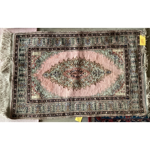 679 - A Tabriz style rug, silk and wool pink central ground  89 x 155cm